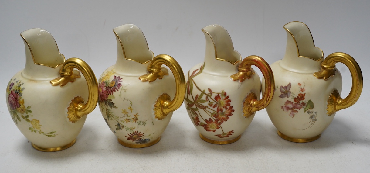 Four Worcester 1094 shape blush ivory floral jugs, 13cm high. Condition - good, some wear